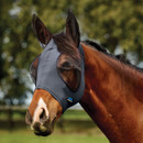 Horse wearing a grey fly mask with mesh ear covers in a field.