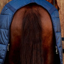 Close-up rear view of horse tail flap on navy quilted stable rug