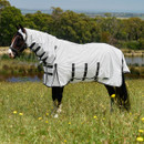 Horse wearing white full neck fly sheet with black straps in grassy field