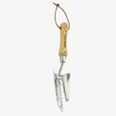 A metal garden trowel with a polished finish and measurement markings. It has a smooth wooden handle with a loop for hanging, set against a white background.