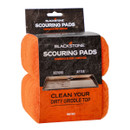Blackstone Scouring Pads two-pack retail box with orange heavy-duty griddle cleaning pads visible on both sides of the packaging.