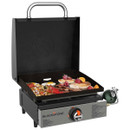 Blackstone tabletop gas griddle with hood open, cooking breakfast including pancakes, bacon and eggs on a flat top surface.