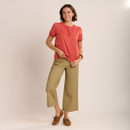 Full-length front view of the outfit featuring the coral printed blouse styled with cropped khaki wide-leg trousers and brown suede loafers.