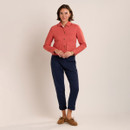 Full-length view of coral cropped jacket paired with a white blouse, navy slim-fit trousers and tan suede loafers.