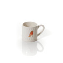 White ceramic mug featuring a red-breasted bird design. The mug has a textured dot pattern and is placed on a reflective white surface.