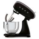 Black SMEG stand mixer with flat beater attachment and stainless steel bowl, three-quarter side view on a white background.