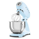 Pastel blue SMEG stand mixer with wire whisk attachment and stainless steel bowl, angled front view.