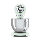 Pastel green SMEG stand mixer with stainless steel bowl shown at an angle on white background