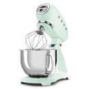 Pastel green SMEG stand mixer with whisk attachment and stainless steel bowl on white background