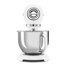 Front view of white Smeg stand mixer highlighting chrome control dial and stainless steel bowl.