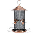 Brushed copper hanging bird feeder with cylindrical black mesh body, multiple feeding ports and perches, shown against a white background.