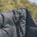 Outwell logo on grey padded camping sofa backrest outdoors