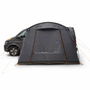 A dark grey tent is attached to the side of a black van. It sits on a white background, showcasing orange trims and guide ropes, creating an adventurous feel.