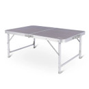 A portable grey folding table with aluminium legs, shown against a white background. Its sturdy design and compact size suggest easy transport and versatility.