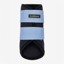 Black equestrian boot with two light blue straps featuring a "LeMieux" label. The design is sleek and functional, suggesting durability.