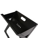 Interior view of Regatta charcoal BBQ grill with lower fuel grate and ventilation holes.