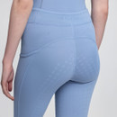 Close-up of back view of a person wearing light blue, textured athletic leggings with a subtle pattern and high waist. The tone is sleek and modern.