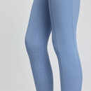 Close-up of sky-blue leggings showcasing textured, subtle dot patterns on the thigh area. The fabric appears smooth and stretchy, conveying comfort and style.