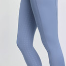 Close-up of a person wearing light blue leggings with a subtle diamond pattern on the back. The smooth fabric suggests comfort and flexibility.