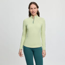 A woman smiles subtly, wearing a light green long-sleeve top with a quarter zip, paired with teal leggings. The background is plain white, conveying a calm and sporty tone.