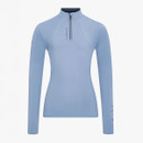 Light blue athletic long-sleeve top with quarter zip, high collar, and "LeMieux" logo. Sleek, streamlined design on white background, conveys sporty elegance.