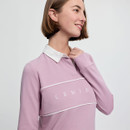 Smiling person in a light purple long-sleeve top with "LEMIE" text, featuring a white collar. The background is plain, conveying a calm mood.
