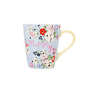 Light blue ceramic mug with a colourful floral pattern and the word “Mummy” in pink script on the front. The handle is a pale yellow colour, and the mug is shown against a plain white background.