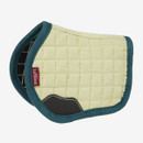 A quilted green equestrian saddle pad with teal edging and a brown leather patch. The brand label is visible. Modern, durable design.