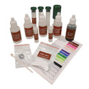 Soil testing kit contents including reagent bottles, test tubes, filter discs, colour chart and accessories for testing pH, nitrogen, phosphorus and potassium levels.