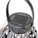 Close-up of solar panel on top of silver effect hanging lantern.