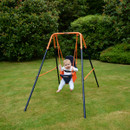 Baby sitting in a Hedstrom garden swing seat attached to a small metal swing frame on a lawn.
