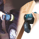 A person uses a Makita power tool on a car's black surface on the left and sands a wooden plank on the right, showing versatility in use.
