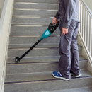 Makita cordless stick vacuum cleaner with long extension tube and floor head attachment: product image on white background.