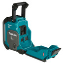 Makita jobsite radio in teal and black with open rear battery compartment and fold-out protective cover.