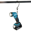 A Makita 18V LED work light is hanging from a hook.