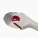 Detailed view of the pizza cutter’s circular stainless-steel blade and central grip ring.