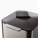 Close-up of the lid with integrated odour filter and handle detail.