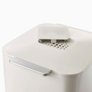 Close-up of the bin lid featuring a carbon filter compartment with Joseph Joseph branding.