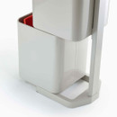 Lower section of the bin pulled out, revealing a removable inner recycling container with red interior.