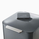 Close-up of the bin lid featuring a carbon filter compartment with Joseph Joseph branding and handle detail.