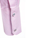 Close-up of shirt cuff with pink and white stripes and button fastening detail.