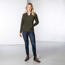 Full-length front view of a woman wearing a khaki half-zip fleece, styled with jeans and brown ankle boots.