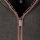 Close-up of the front zip with contrast trim and branded pull tab.