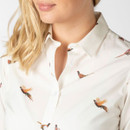 Close-up of the cream shirt showing the pheasant print and open collar detail.