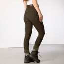 Rear view of a woman wearing olive green walking trousers with a high waist and back pockets, styled with hiking boots.