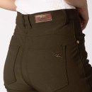 Close-up of the back of olive green trousers showing stitched pockets, belt loops and branded leather patch detail.