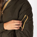 Close-up of a khaki bomber jacket sleeve showing a zip pocket with contrast trim and branded zip pull.