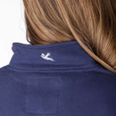 Close-up of the back collar featuring a small embroidered bird logo on the navy panel.