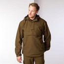 Front view of a model wearing a light khaki shooting smock with hood, front flap pocket and side entry pockets.