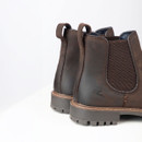 Close-up of the rear side showing the elastic gusset, heel pull tabs and subtle embossed logo detail.
